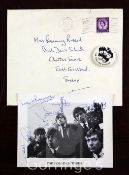 The Rolling Stones: A signed vintage postcard photograph signed by all five members of the band, and