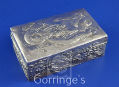 An early 20th century Japanese silver mounted hardwood cigarette box, of rectangular form, the lid