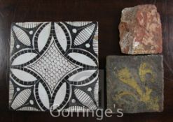 A Medieval encaustic tile, decorated with a fleur de lys, 5in. another incomplete tile and a further