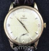 A gentleman's late 1950's 9ct gold Omega manual wind wrist watch, with arrow head and quarterly