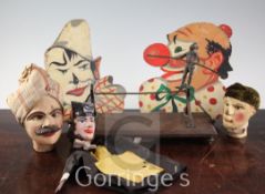A group of circus items comprising a bronze of a trapeze artist, 12in., two French painted clown