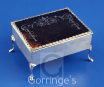 An Edwardian silver and tortoiseshell trinket box, of rectangular form, the tortoiseshell lid with