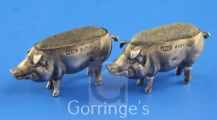 A near pair of Edwardian silver novelty pin cushions, each modelled as a pig, Adie & Lovekin Ltd,
