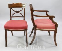 A set of fourteen Regency mahogany dining chairs, including two carvers, with X shaped spars, padded