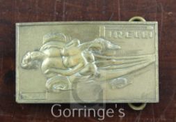 A Salvador Dali for Pirelli brass belt buckle, numbered NR0032, 4in., in original Deane & Adams box