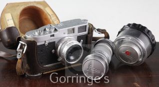 A Leica M-2 Rangefinder camera, with Summaron 1:2.8/35 lens, case no.970810 and Elmar 1:2.8 lens,