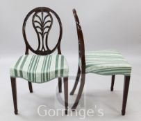 A pair of George III Hepplewhite style mahogany dining chairs, with anthemion splats and padded