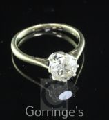 A 9ct gold and solitaire diamond ring, the round brilliant cut stone weighing approximately 1.