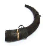 19TH CENTURY - A NORTH AFRICAN COW HORN POWDER FLASK  with engraved brass mounts, 36cm long