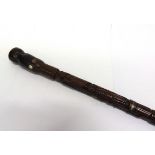19TH CENTURY - AMERICAN CIVIL WAR  - A RARE CARVED AND STAINED FOLK ART CANE the shaft with civil