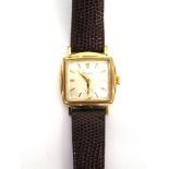 BULOVA, A GENTLEMAN'S 1950'S GILT WRIST WATCH the rectangular shaped case and white dial with gilt