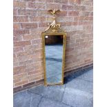 AN EMPIRE STYLE GILT FRAMED PIER MIRROR, the bevelled mirror 28cm x 88cm, 128cm high including eagle