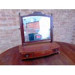 A 19TH CENTURY MAHOGANY DRESSING TABLE MIRROR, the bow front base fitted with three drawers, 62cm