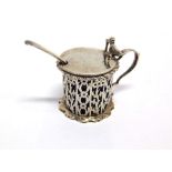 A LATE VICTORIAN SILVER MUSTARD POT by George Fox, London 1896, of pierced drum form, volute thumb