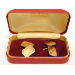 A PAIR OF 9 CARAT GOLD CUFFLINKS the rectangular cut corner plain panel chain linked to a