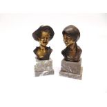 AFTER GIOVANNI DE MARTINO (ITALIAN 1870-1935): a pair of busts of a young boy and girl, on stepped