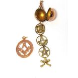 AN UNUSUAL MASONIC FOB in the form of an orb surmounted by a star and compass, opening to reveal