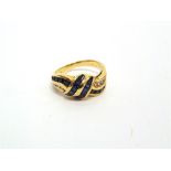 A SAPPHIRE AND DIAMOND DRESS RING stamped '750', the stones all channel set, finger size K 1/2, 4.7g