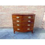 A 19TH CENTURY MAHOGANY BOWFRONT CHEST of two short and three long drawers on splayed bracket