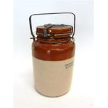 A GREAT WAR BRITISH ANTI-GAS OINTMENT STONEWARE JAR with a screw top and metal carrying handle, 25.