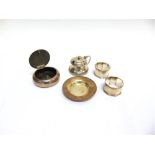 A SILVER CIRCULAR TABACCO BOX a silver mustard pot, with glass liner; a pair of silver napkin rings;