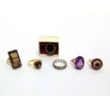 A COLLECTION OF FOUR STONE SET DRESS RINGS three 9 carat, 30g gross, and one stamped '18ct', 3g