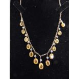 A CITRINE FRINGE NECKLACE the thirteen graduated oval cuts to knife edge suspensions with a