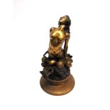 A BRONZED FIGURE OF A MERMAID emerging from a stylised wave, on circular spreading base, 53cm high