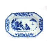 A CHINESE EXPORT DISH OF OCTAGONAL FORM, underglaze blue decoration of a coastal scene within floral