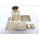 A SILVER TOPPED SCENT BOTTLE the glass body with hinged cover; a silver Rococo style desk seal,