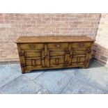 A REPRODUCTION 'IPSWICH OAK' DRESSER BASE fitted with three drawers over three cupboards, 168cm wide