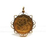 A 1915 SOVEREIGN in a scrolled edge pendant mount, stamped 9ct, 9.6g gross