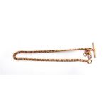 A 9 CARAT GOLD WATCH CHAIN of uniform solid curb links, with a T bar, swivel and bolt ring, 37.5cm