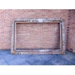 AN EXCEPTIONALLY LARGE GILT GESSO PICTURE FRAME the aperture 239cm x 146cm (overall 288cm x 197cm).