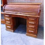 AN OAK TWIN PEDESTAL ROLL-TOP DESK, with fitted interior, 122cm wide 69cm deep 103cm high