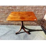 A MAHOGANY TILT TOP OCCASIONAL TABLE, the oblong top 75cm x 54cm on turned pillar tripod support