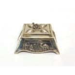 AN EDWARDIAN SILVER BOX by Mappin and Webb, London 1901, with desert scene to the front panel and