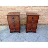 A PAIR OF GEORGE III STYLE MAHOGANY PEDESTAL CHESTS, the moulded top over four graduated drawers