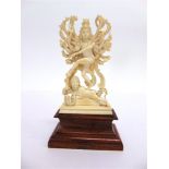 AN INDIAN CARVED IVORY FIGURE OF SHIVA late 19th or early 20th century, in Nataraja (cosmic