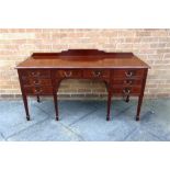 A MAHOGANY SIDEBOARD fitted with eight drawers on spade feet, 150cm wide 56.5cm deep 83cm high,