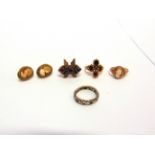 A 9 CARAT GOLD GARNET DRESS RING finger size L, 4.7g gross; a cameo ring; a pair of cameo