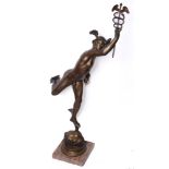 A LARGE PATINATED METAL FIGURE OF MERCURY with winged helmet and ankles, holding aloft a caduceus,