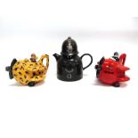 THREE CARLTON WARE NOVELTY TEAPOTS: two modelled as bi-planes 'Red Baron' and 'Cheetah', the third