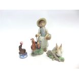 THREE LLADRO FIGURES: a young girl with three turkeys (top of staff damaged), 21cm high; a seated