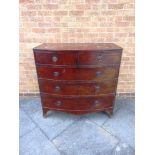 A MAHOGANY BOW FRONT CHEST of two short and three long drawers on splayed bracket feet, 107cm wide