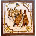 A HERMES SILK SCARF 'ATTELAGE EN ARBALETE' 88cm x 88cm.