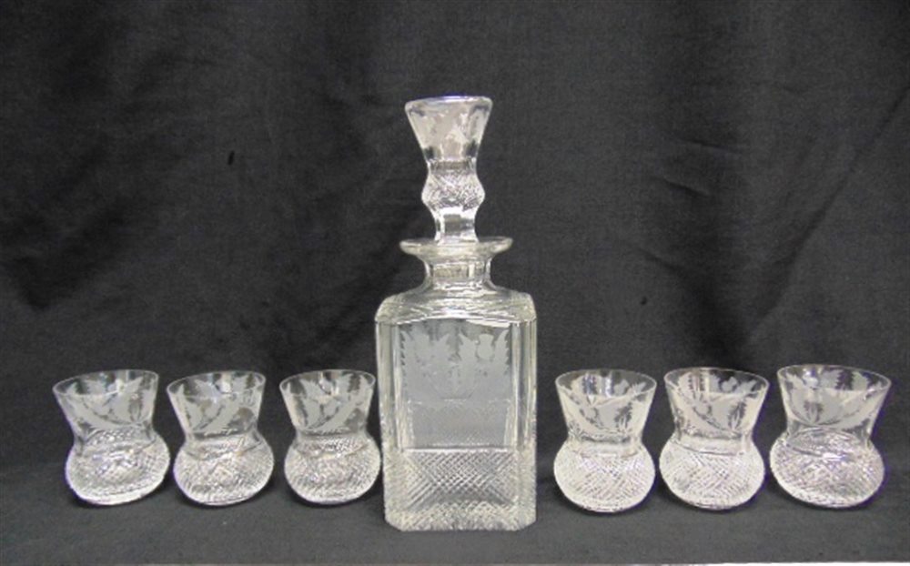 EDINBURGH CRYSTAL: A LEAD CRYSTAL DECANTER AND STOPPER 26.5CM HIGH and matching set of six thistle