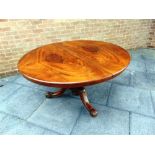 A VICTORIAN WALNUT CIRCULAR TILT-TOP BREAKFAST TABLE the pedestal raised on three outswept supports,