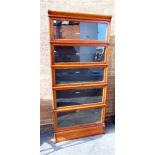 A MAHOGANY GLOBE WERNICKE FIVE TIER SECTIONAL BOOKCASE, each section with ivorine label 'The Globe