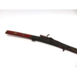 19TH CENTURY - AN INDIAN MATCHLOCK MUSKET with a red lacquer finish to stock, inlaid with bone